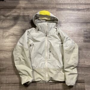 White and yellow arcteryx ski jacket